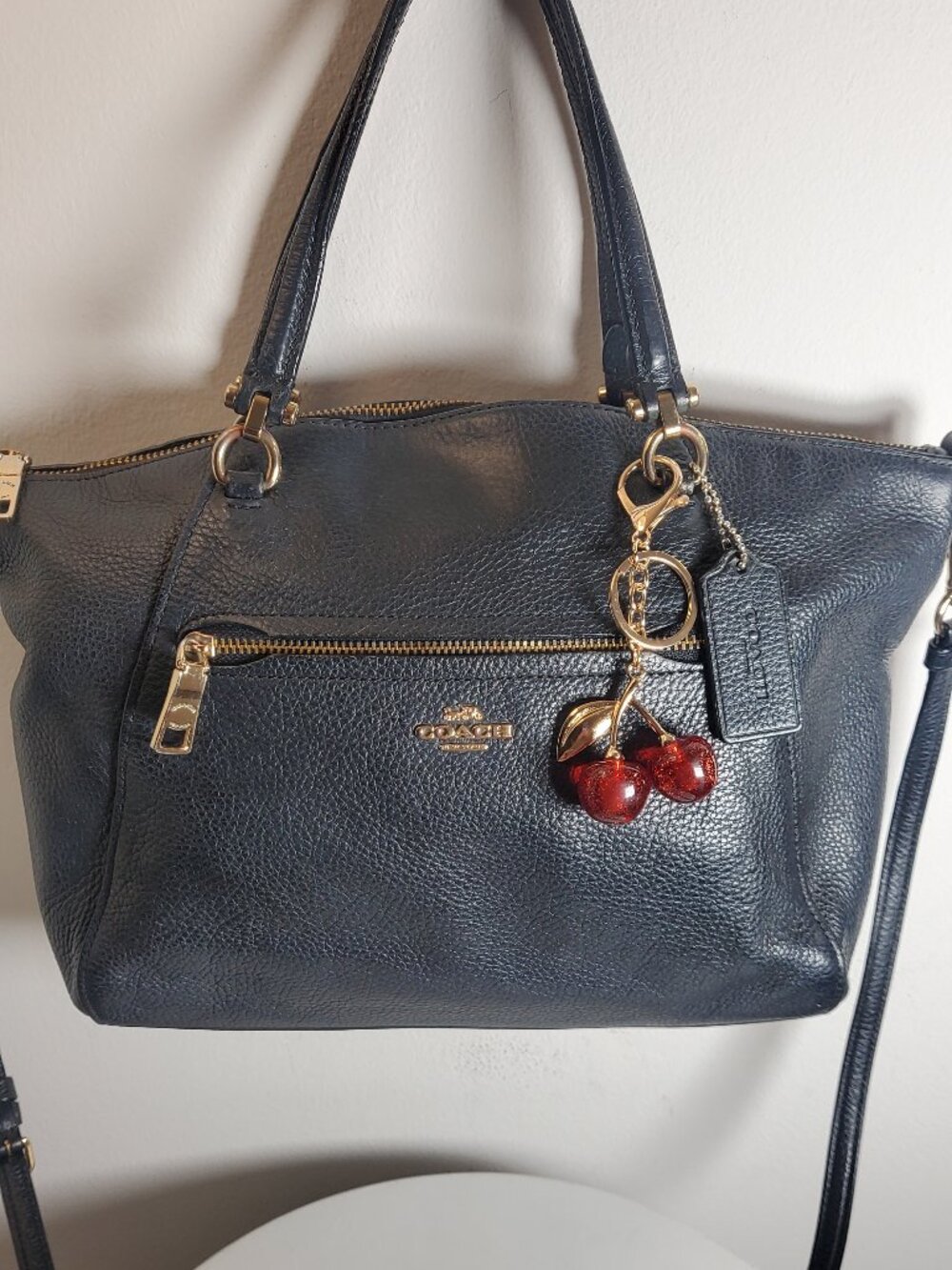 56. Coach Navy pebbled leather zip satchel top handle bag